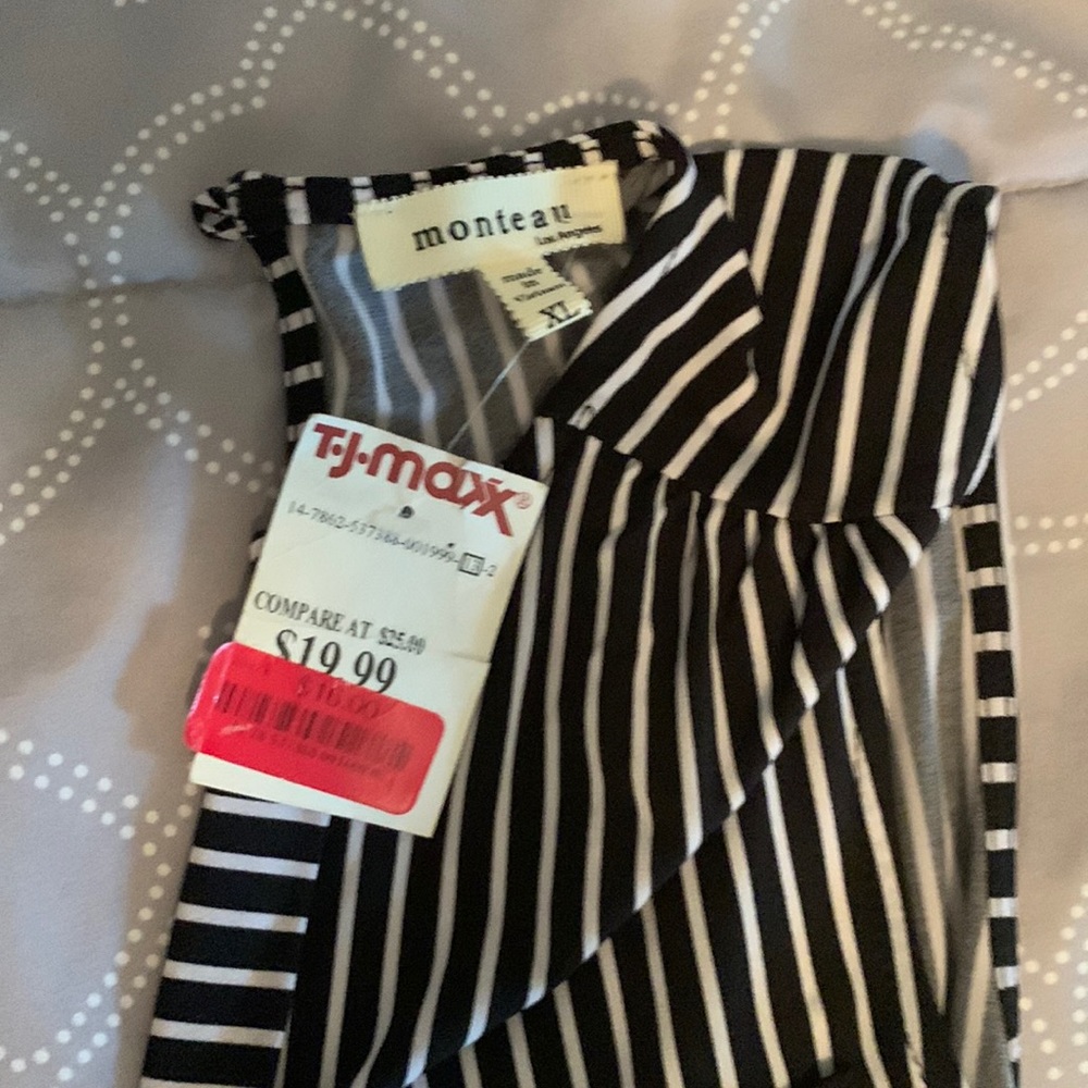 Female jumper never worn new with tags.  Blue and white pinstripes